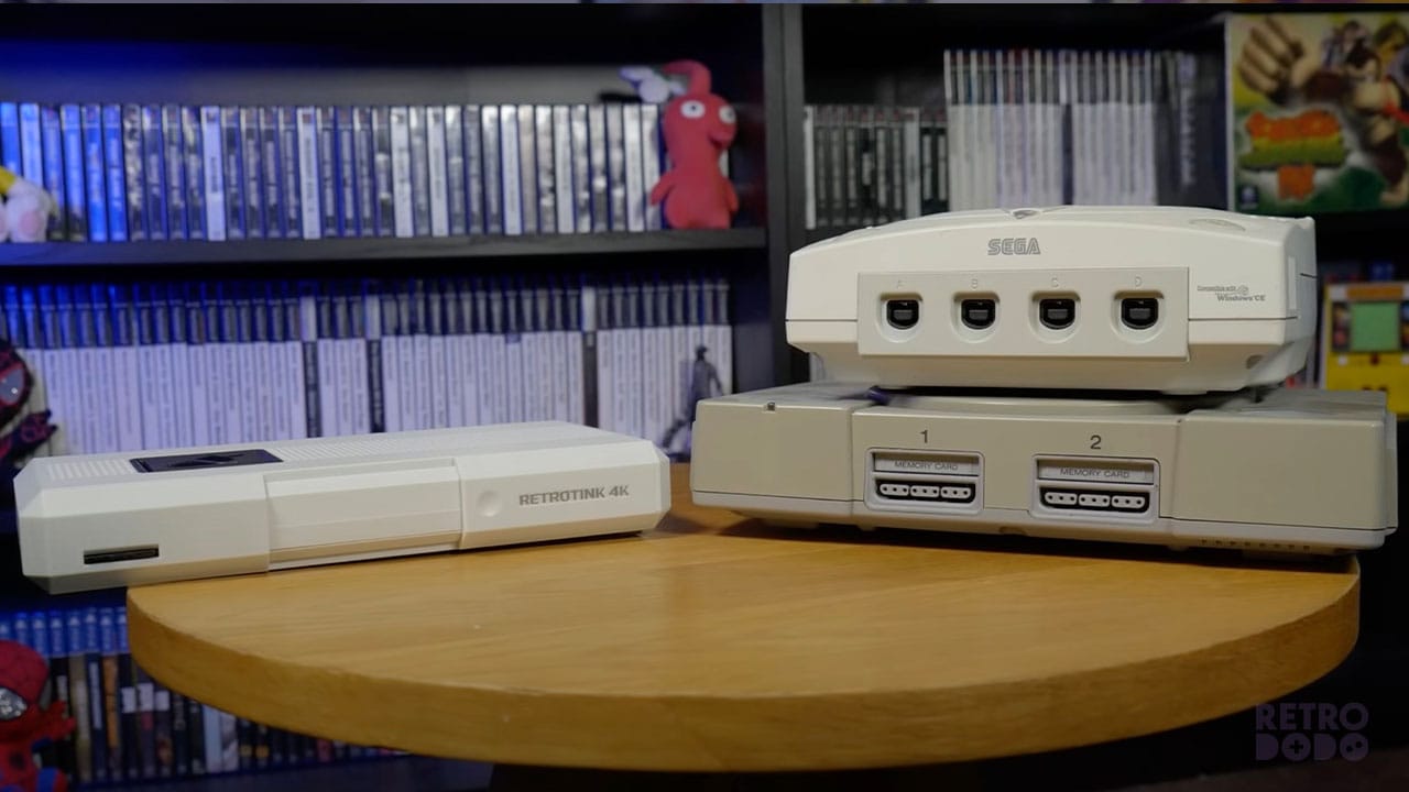 The RetroTINE-4K CE next to a PS1 and Dreamcast