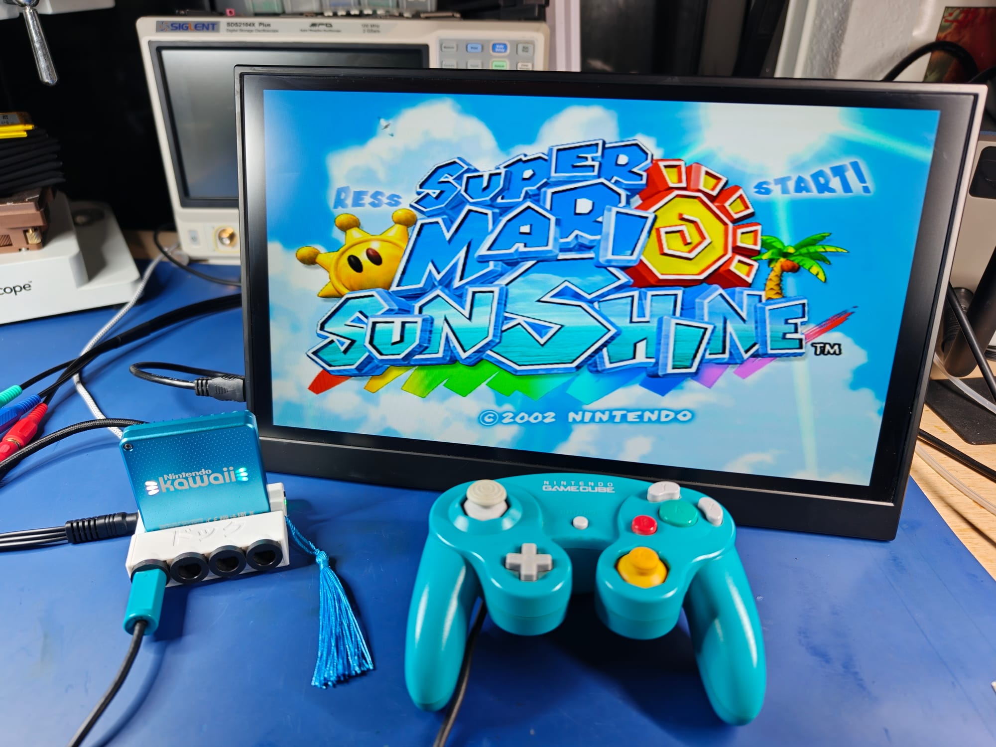 The Kawaii hooked up to a TV and a GameCube controller