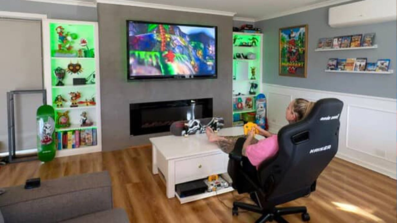 Maggie playing Donkey Kong 64 in her games room