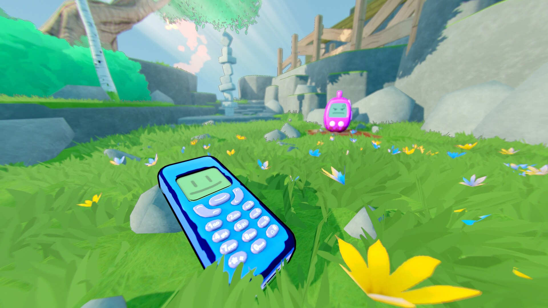 A phone with a smily cartoon face laying in grass