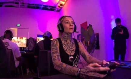 Maggie gaming with a headset on