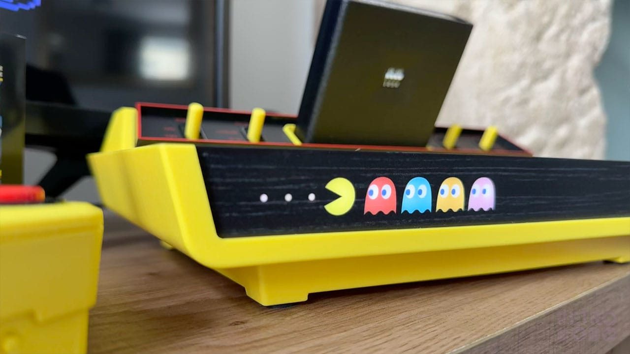 PAC-MAN and the four ghosts lit up on the front of the console