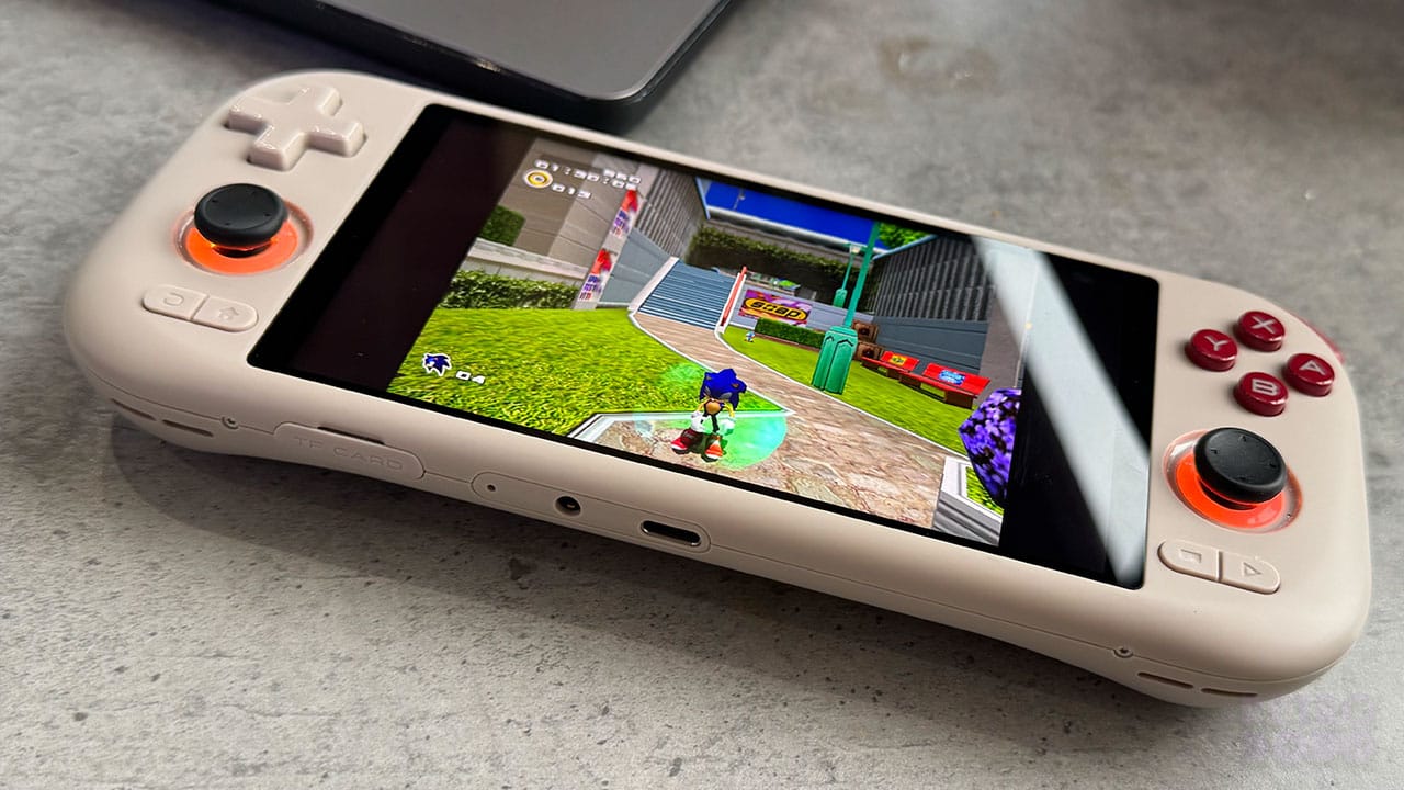 Sonic Adventure 2 gameplay on a handheld resting on a granite table