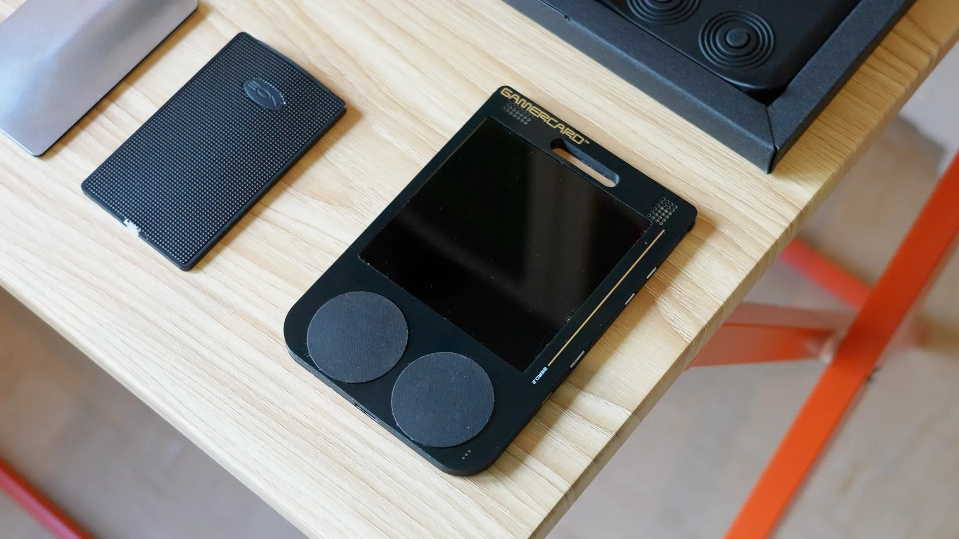 GAMERCARD next to SInclair's super thin flashlights.