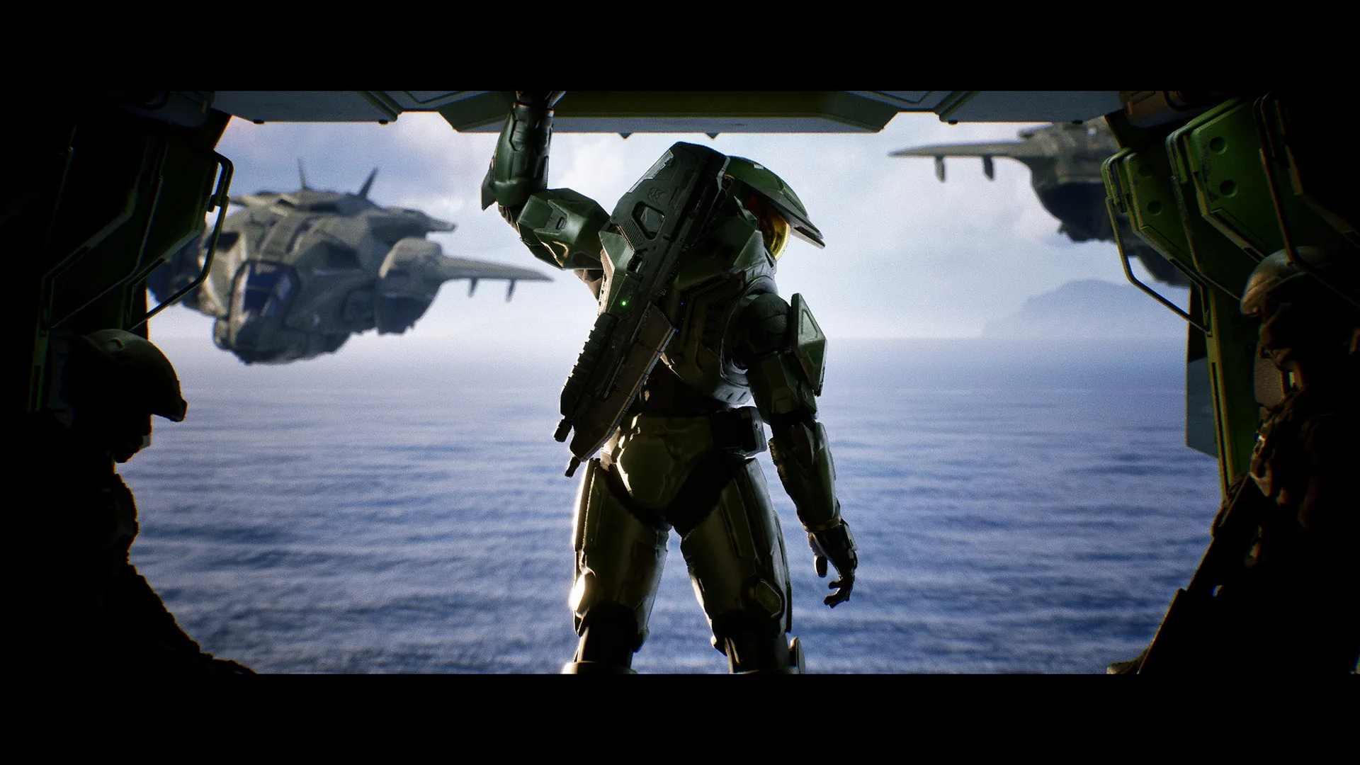 Master Chief sstanding in the back of a plane
