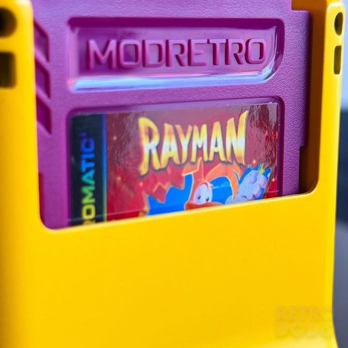 Close up of a purple cartridge inside a yellow handheld