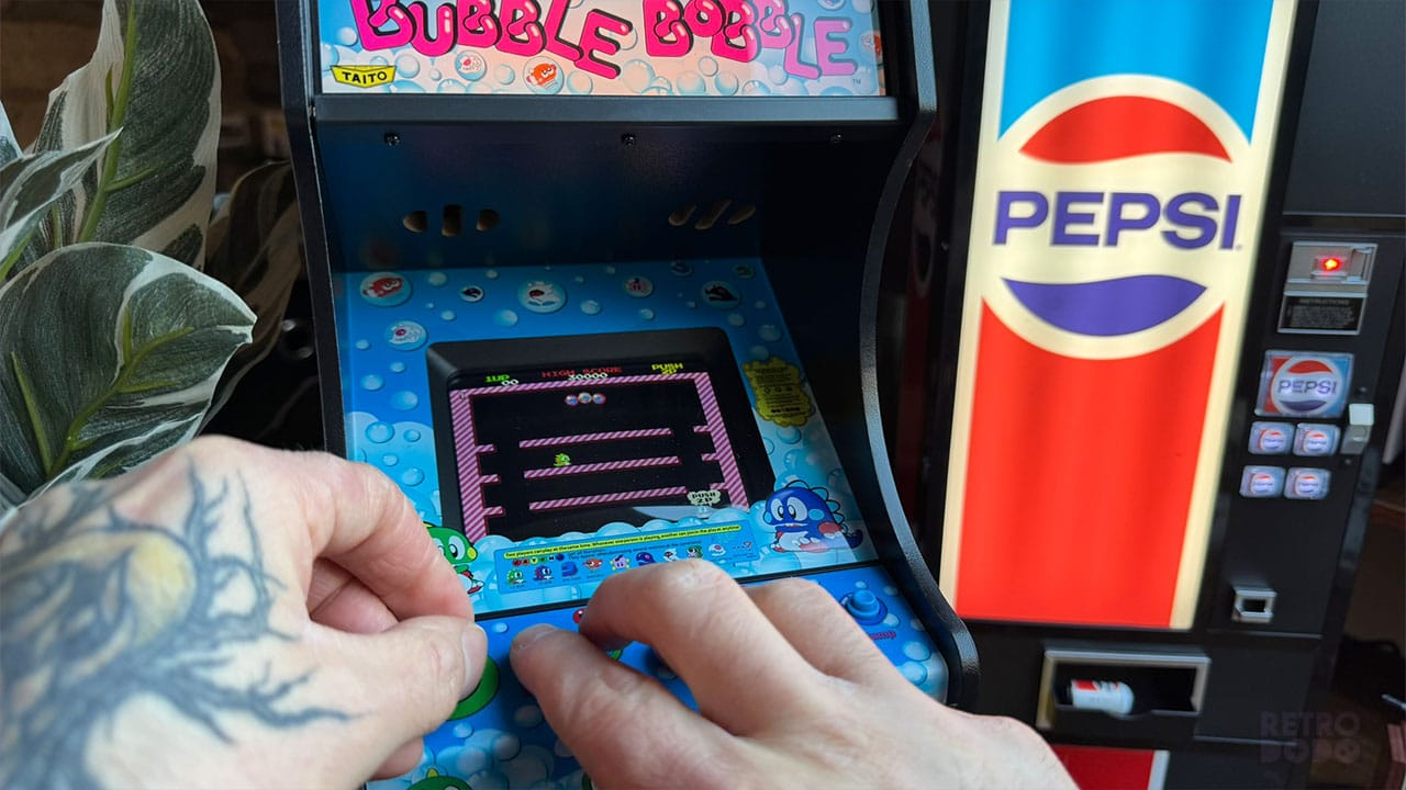 Seb playing on the Bubble Bobble Quarter Arcades unit