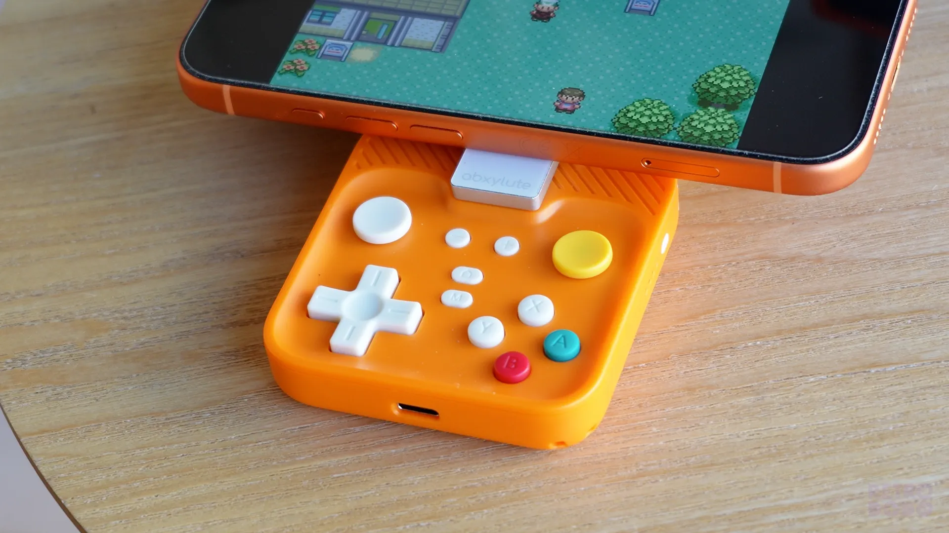 Button layout on an orange mobile snap-on controller