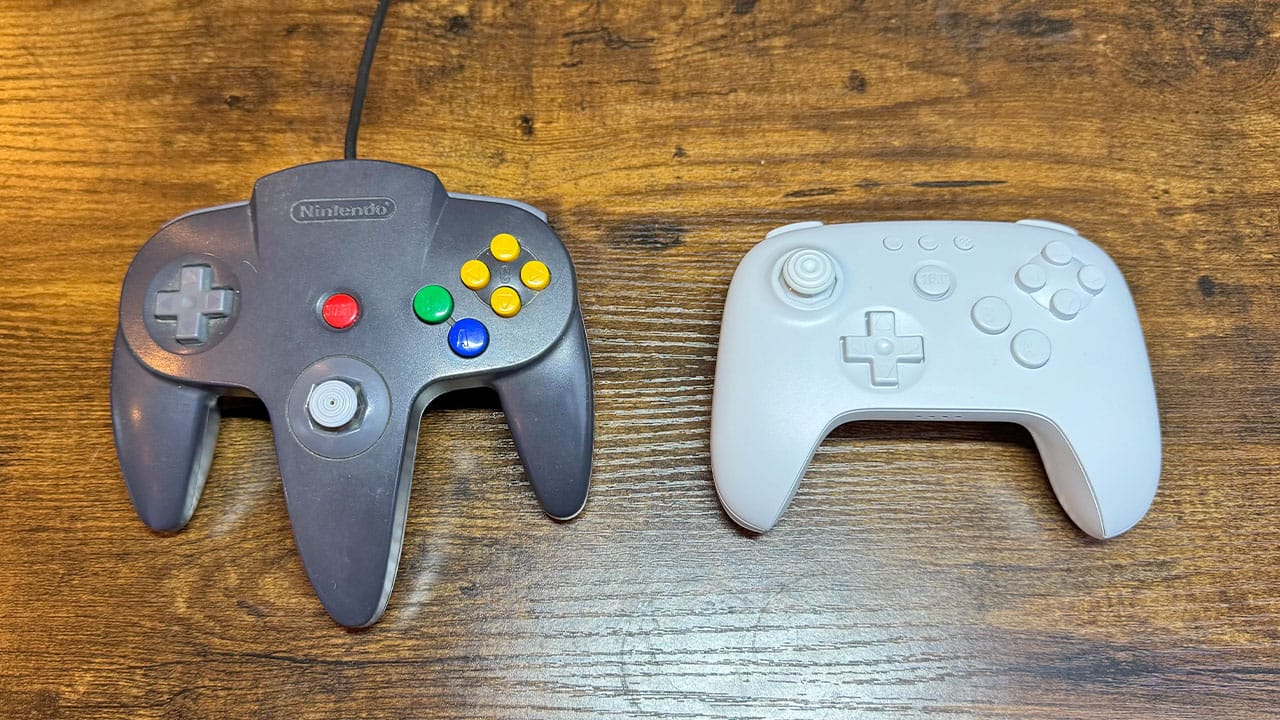 Black N64 controller next to a white 8BitDo 64 controller