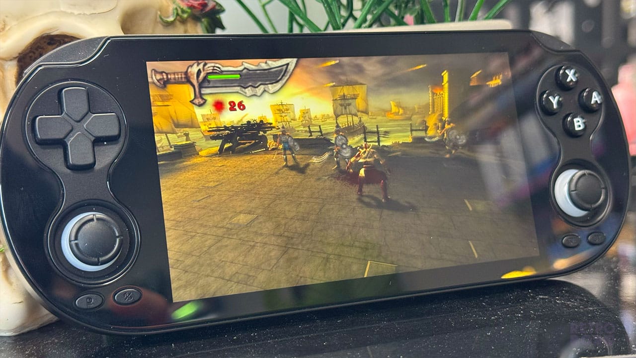 PSP gameplay showing God of War: Chains of Olympus on the RG Vita