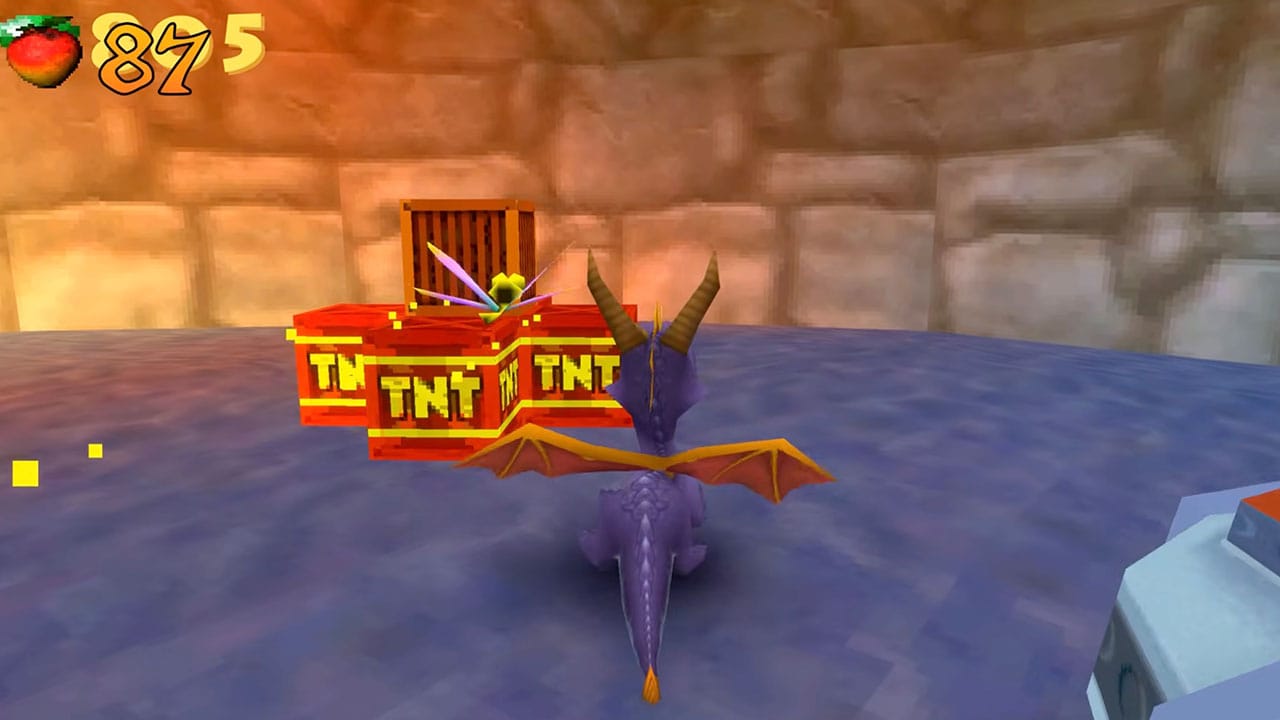 Spyro running towards Crash Bandicoot TNT boxes