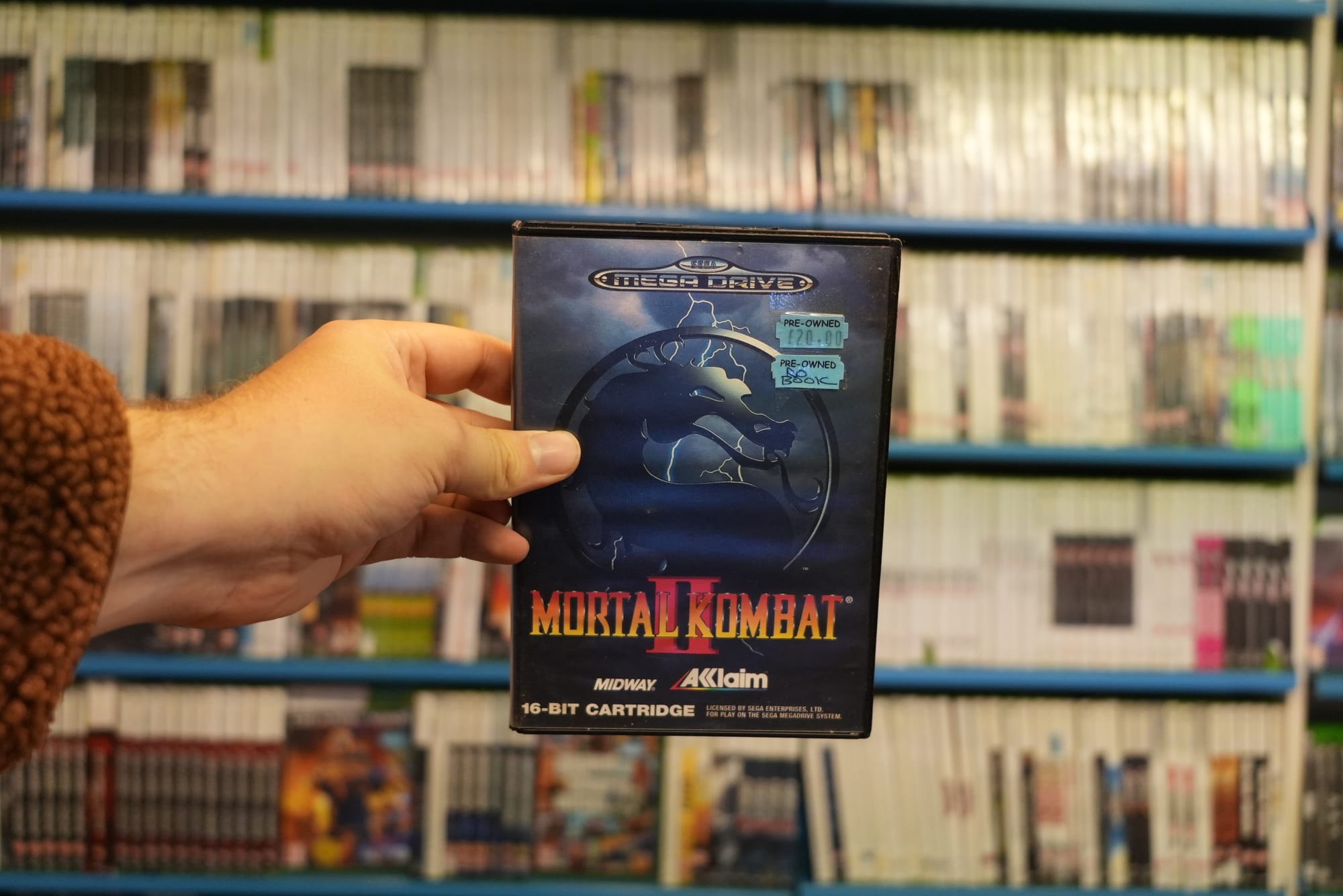 Brandon holding up Mortal Kombat II