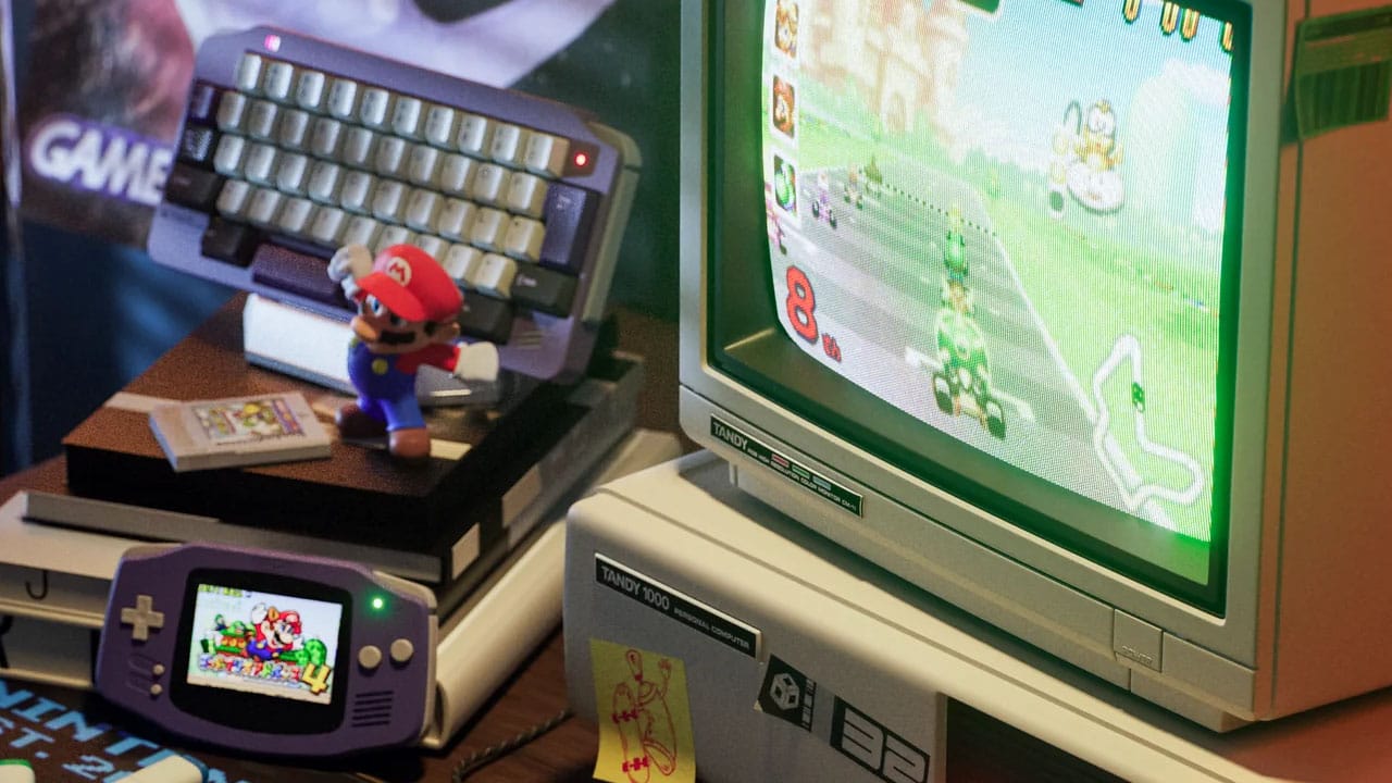 Purple GBA and the corresponding KeyBoy Advance on a desk