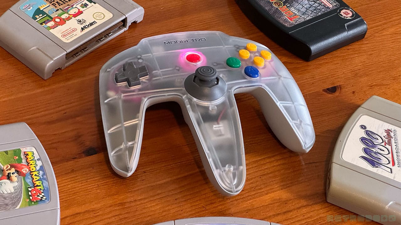 M64 remote surrounded by games