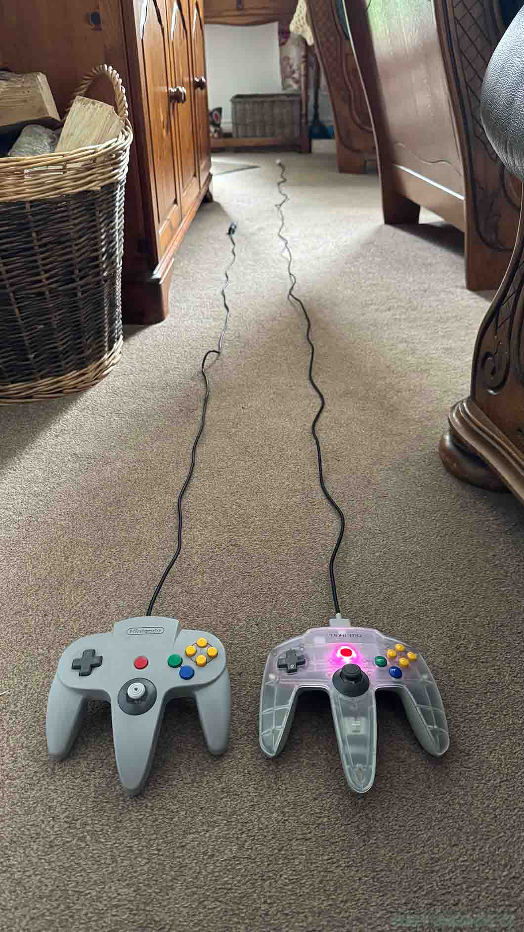 Cable length comparison between the N64 remote (left) and the M64 game pad (right)
