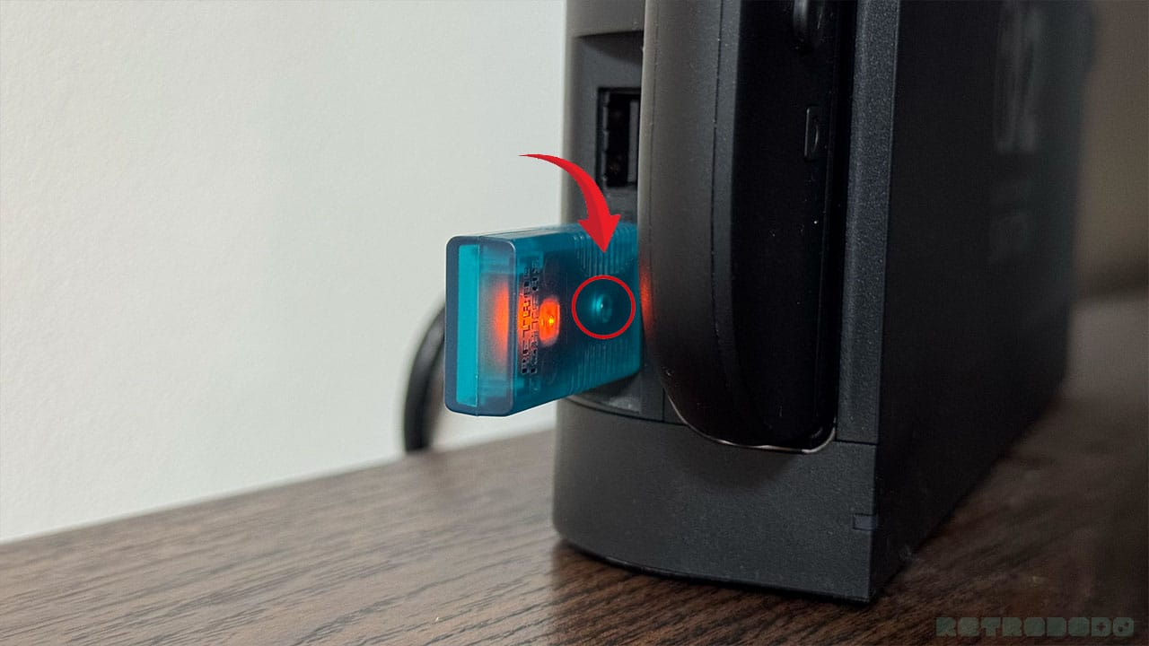 Blue USB dongle in a Switch 2