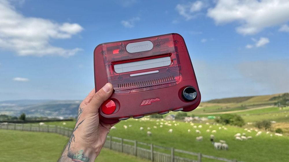 M64 (red) held up in the air above a field