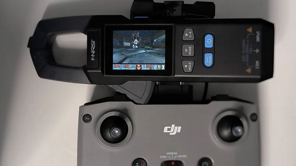 Doom running on a multimeter, powered by a DJI controller