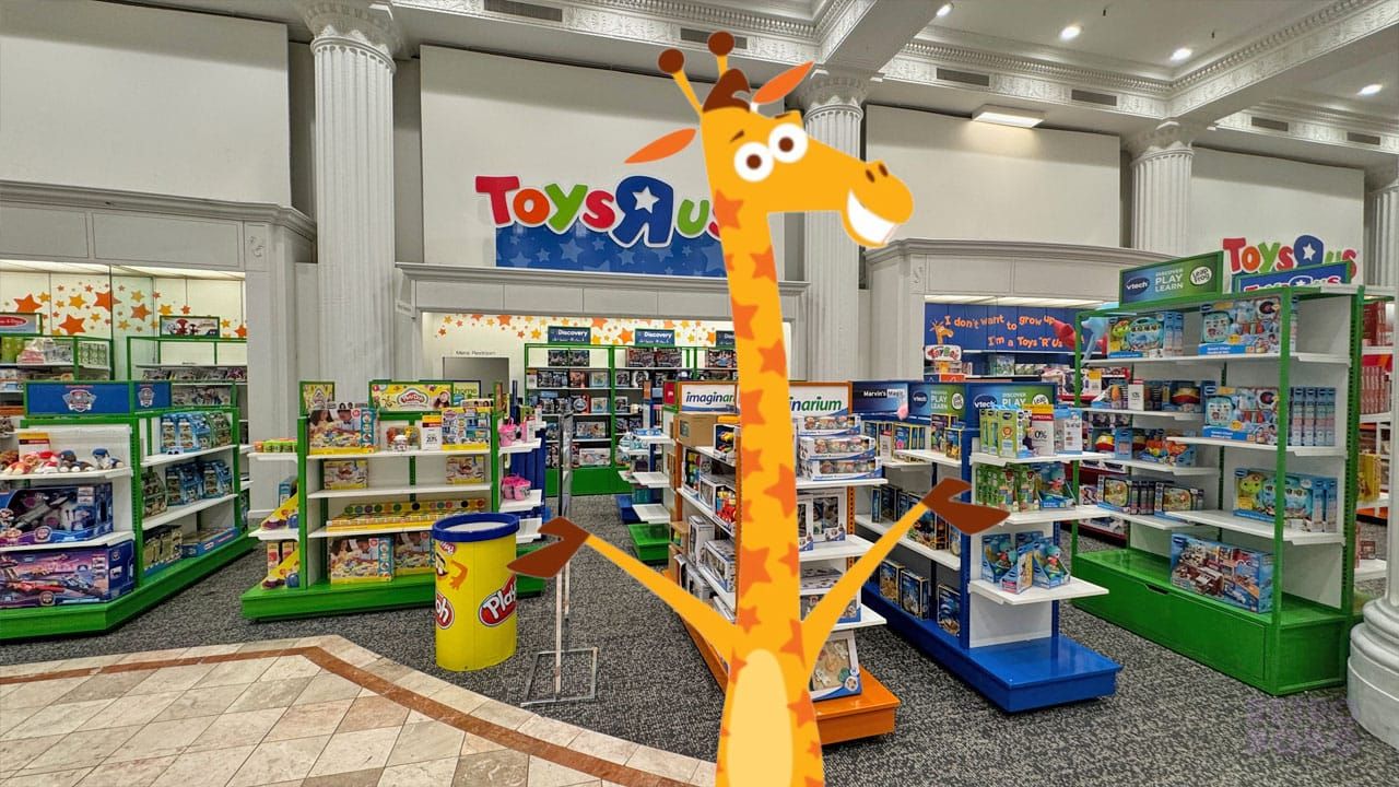 A Toys 'R' Us store with Geoffrey the Giraffe in front of the stands
