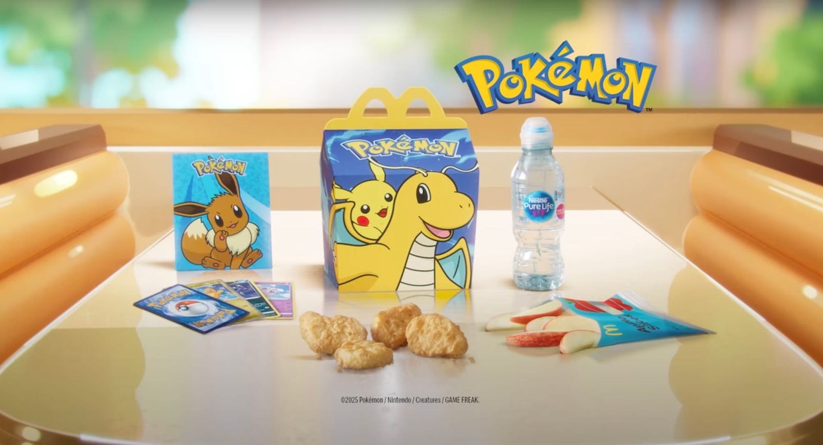 A happy meal box with pokemon cards
