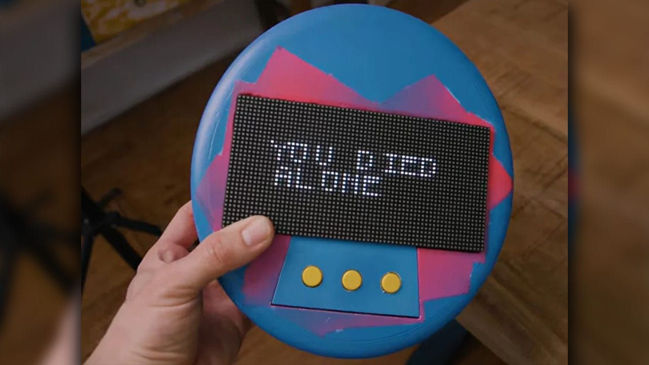 A giant Tamagotchi with a dark message on the screen