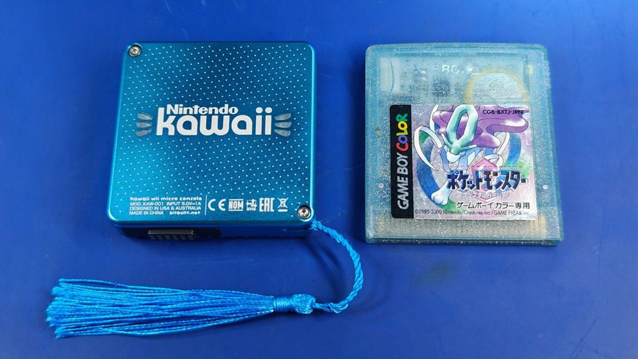 A miniature Wii console next to Pokémon Crystal