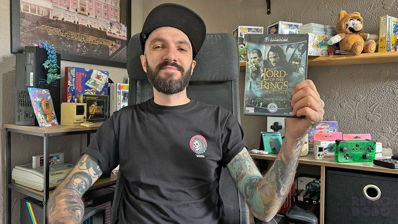 Seb holding a copy of The Two Towers, Lord Of The Rings GameCube game