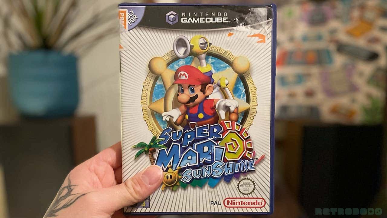 Seb holding his copy of Super Mario Sunshine