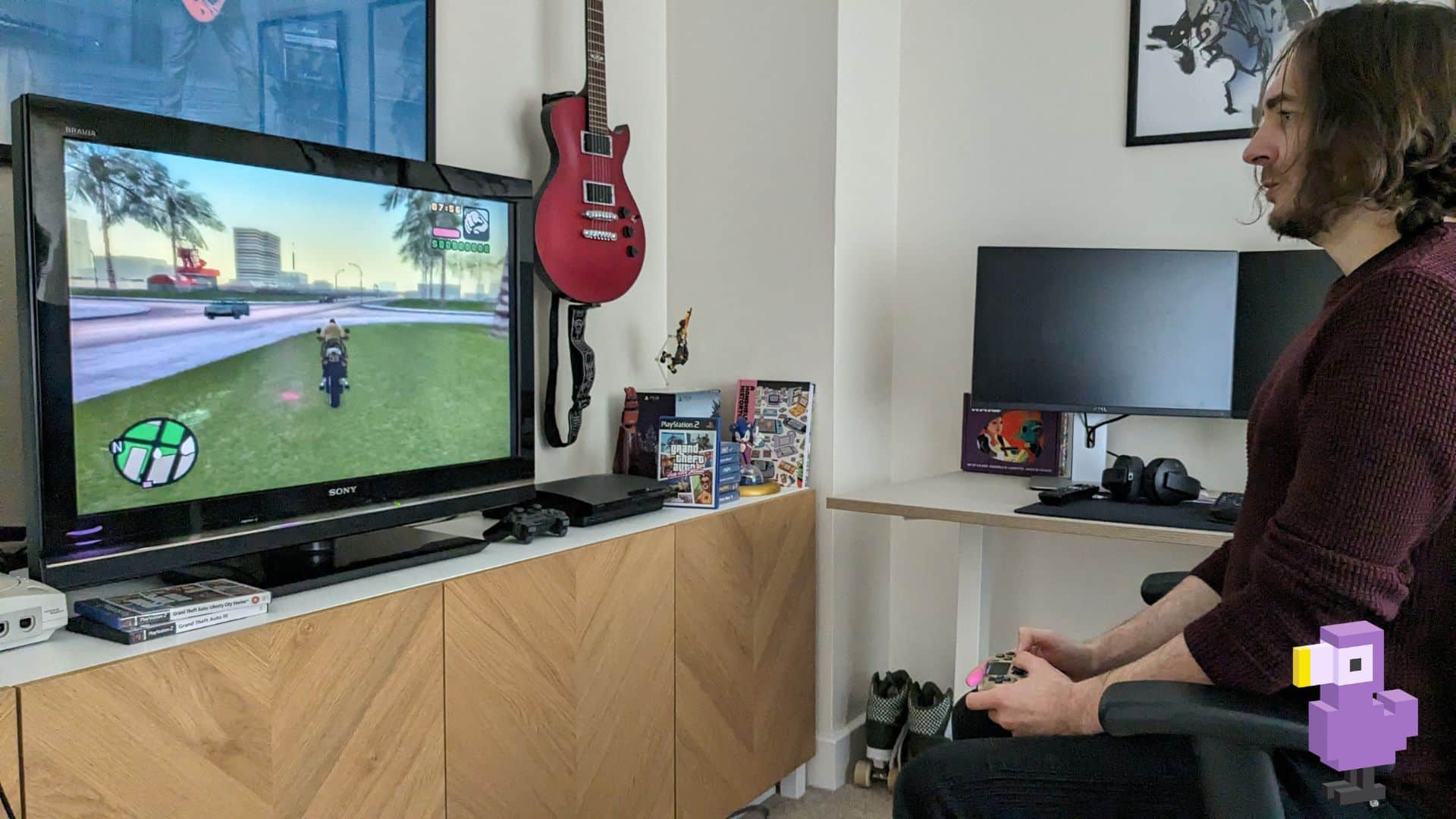 Theo playing Grand Theft Auto: Vice City Stories (2006)
