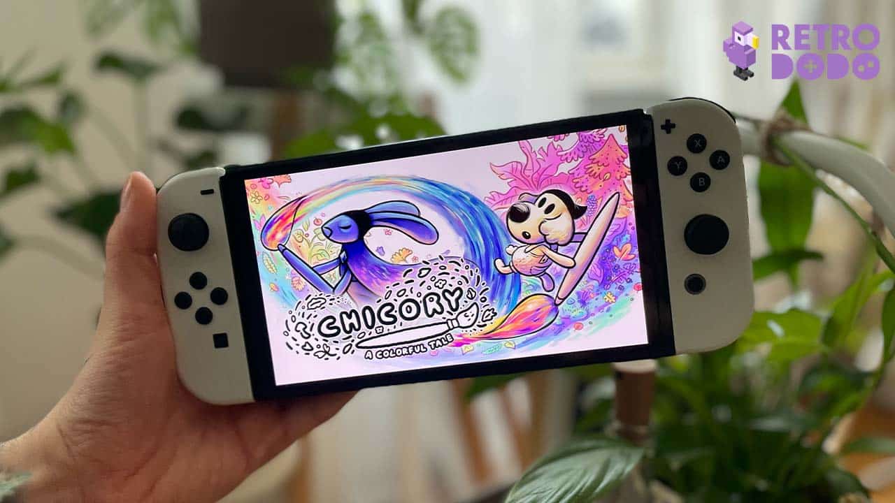 A white Nintendo Switch showing game art for Chicory A Colorful Tale