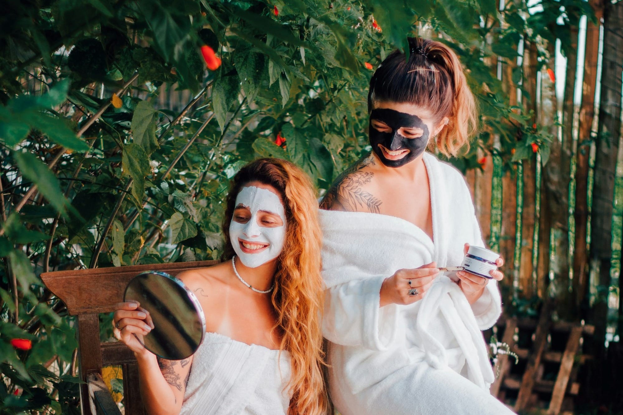 two women sitting on a chair