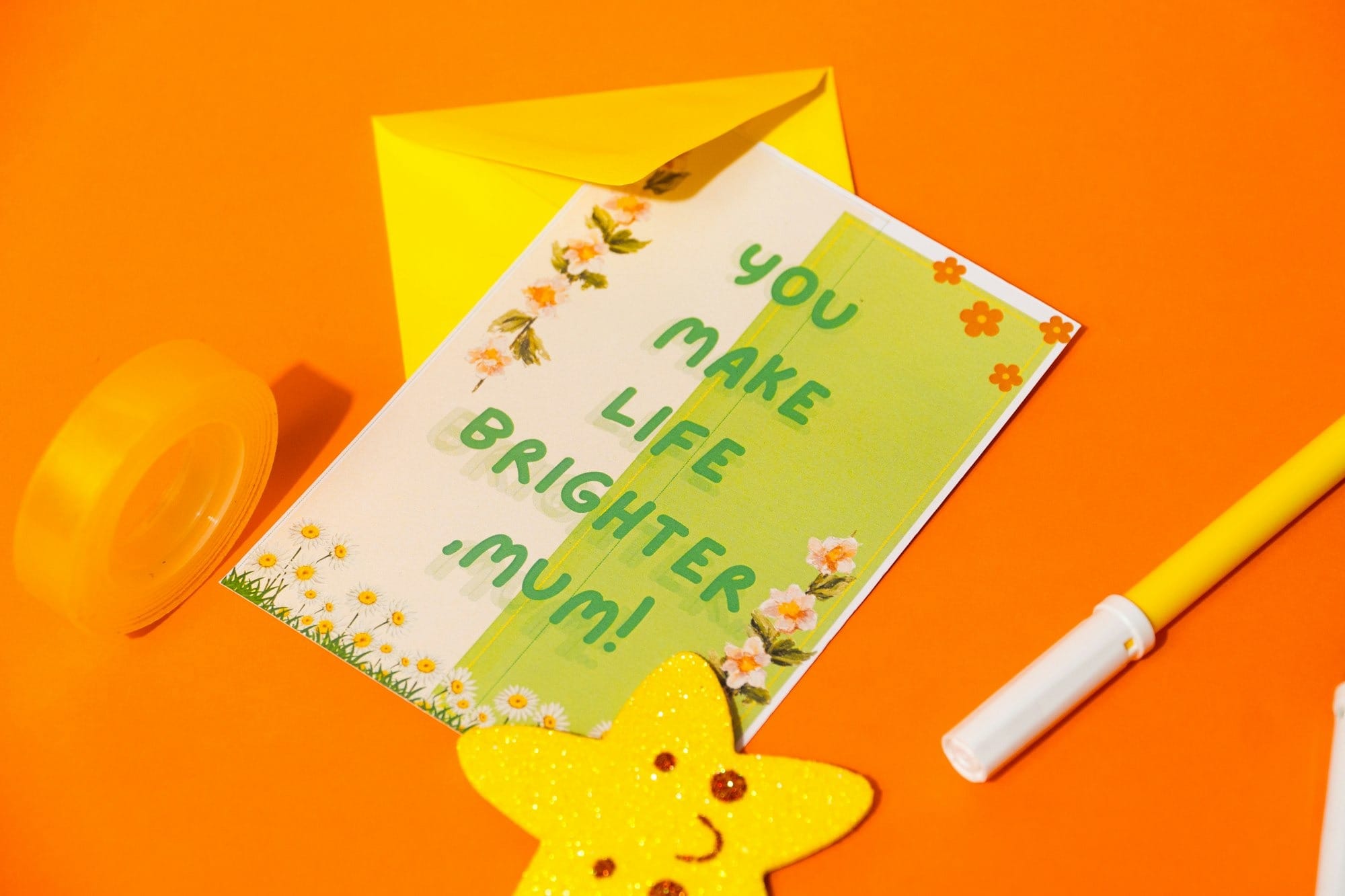 A handmade card with "you make life brighter, mum!"