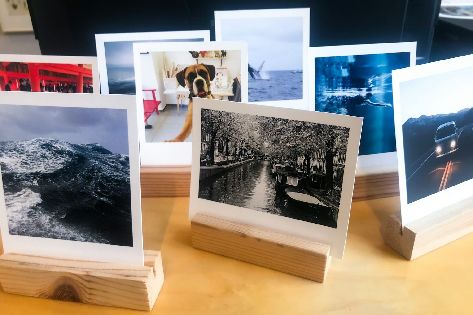 black and white picture frame on brown wooden table