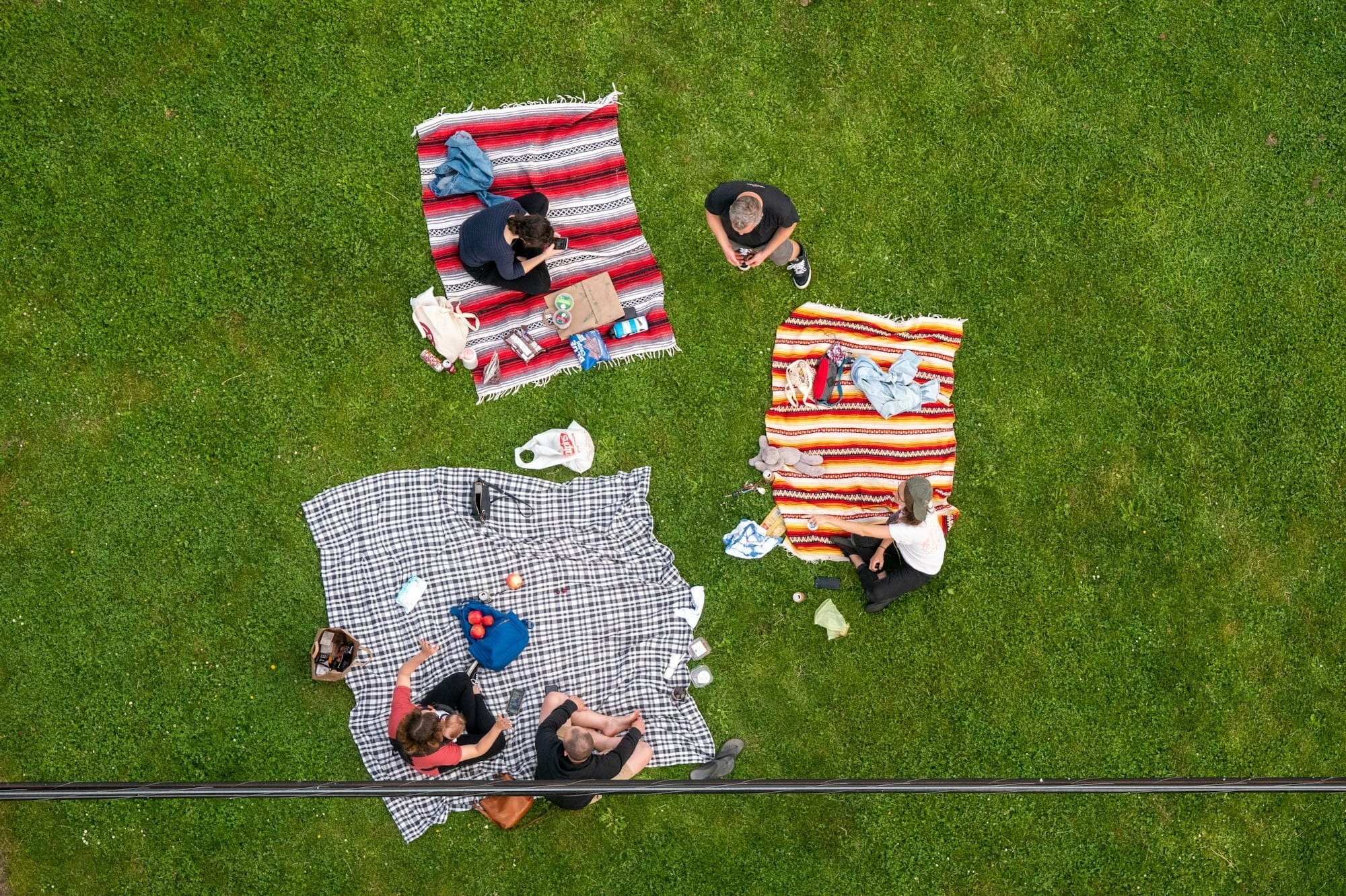 red white and black flag on green grass field