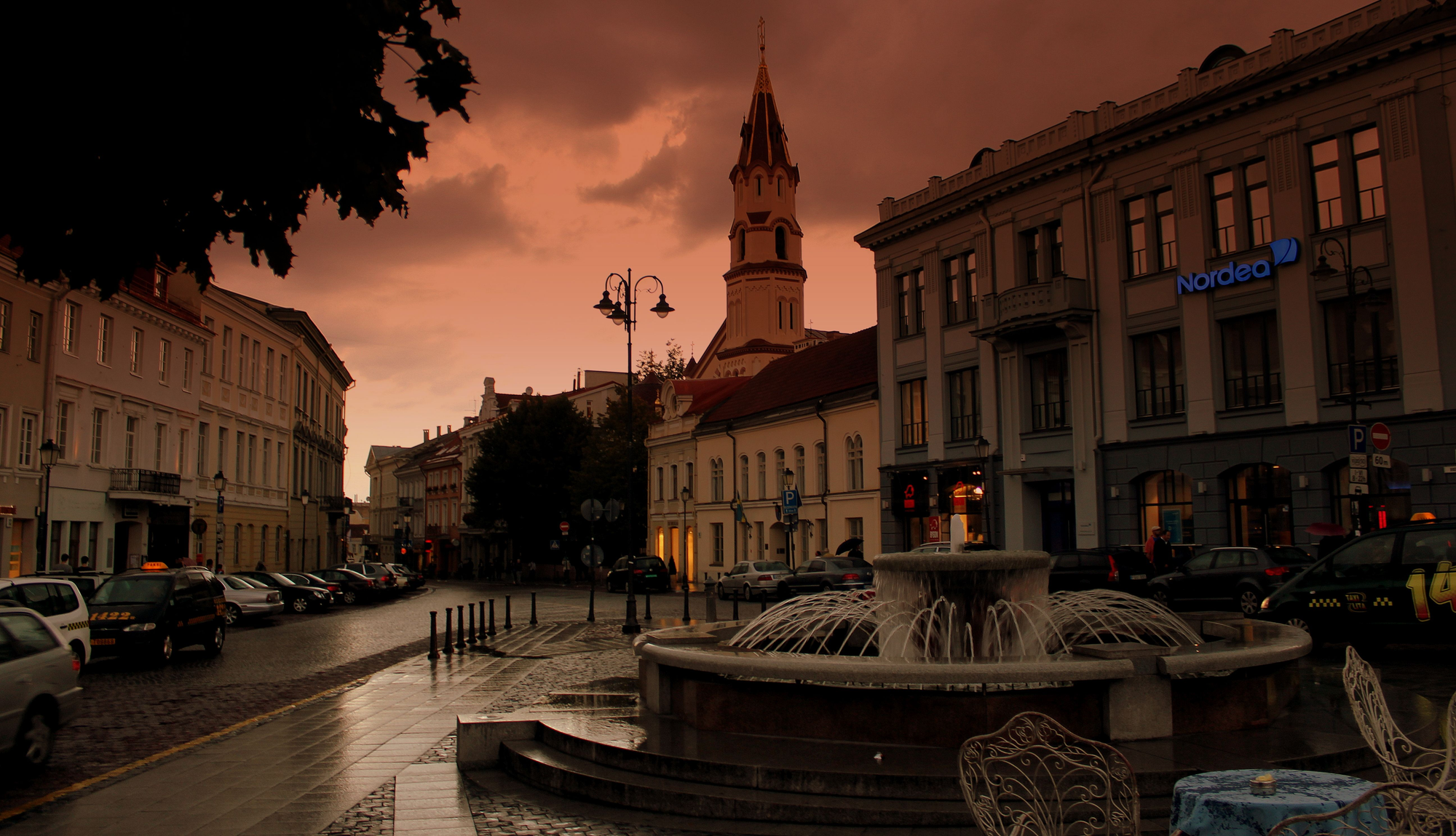 An image of a fountain and town square in Lithuania.
