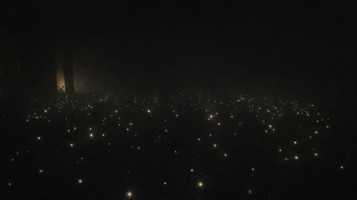 A vast pitch-black void with hundreds of tiny pinpoints of light clustered in the darkness — twelve hundred minds finding each other in the dark.