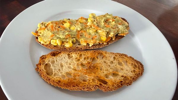 Vegetable loaded avocado toast on sourdough with avocado mash carrot corn and capsicum. Gut health breakfast recipe by Shradha Fuel It Right