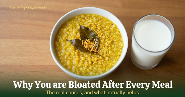 hotorealistic overhead photo of a bowl of dal tempered with hing, alongside a glass of buttermilk, with headline "Why You're Bloated After Every Meal" for the Fuel It Right blog