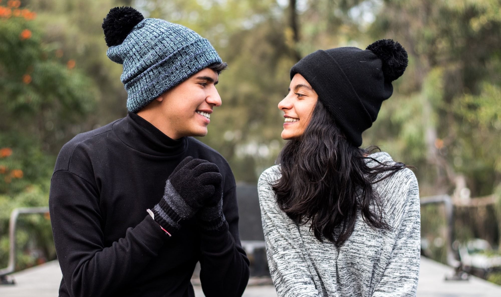 woman in black and gray knit cap and gray sweater