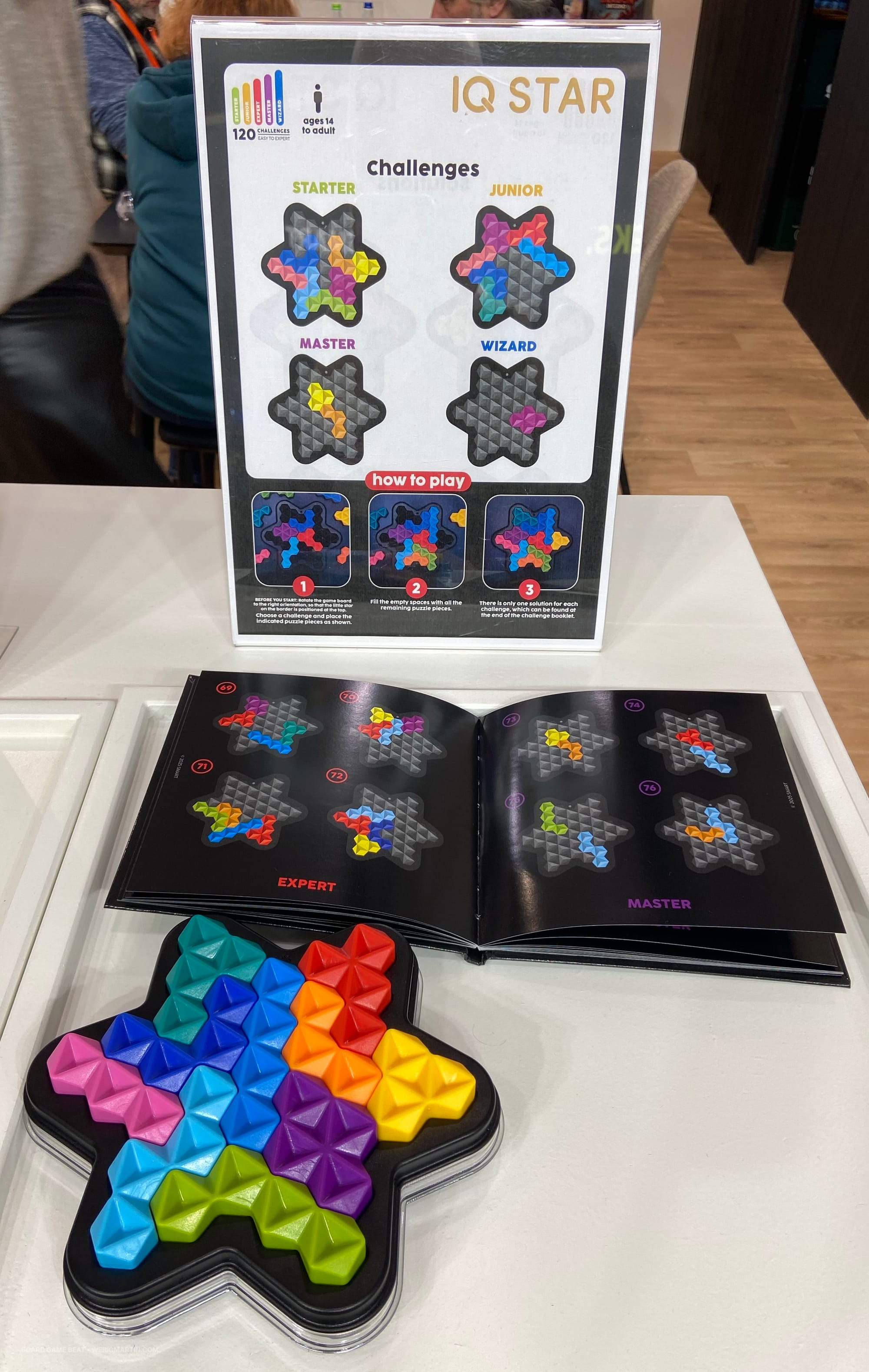 Ten plastic 3D pieces made from weird semi-hexagons are placed in a six-pointed star-shaped grid