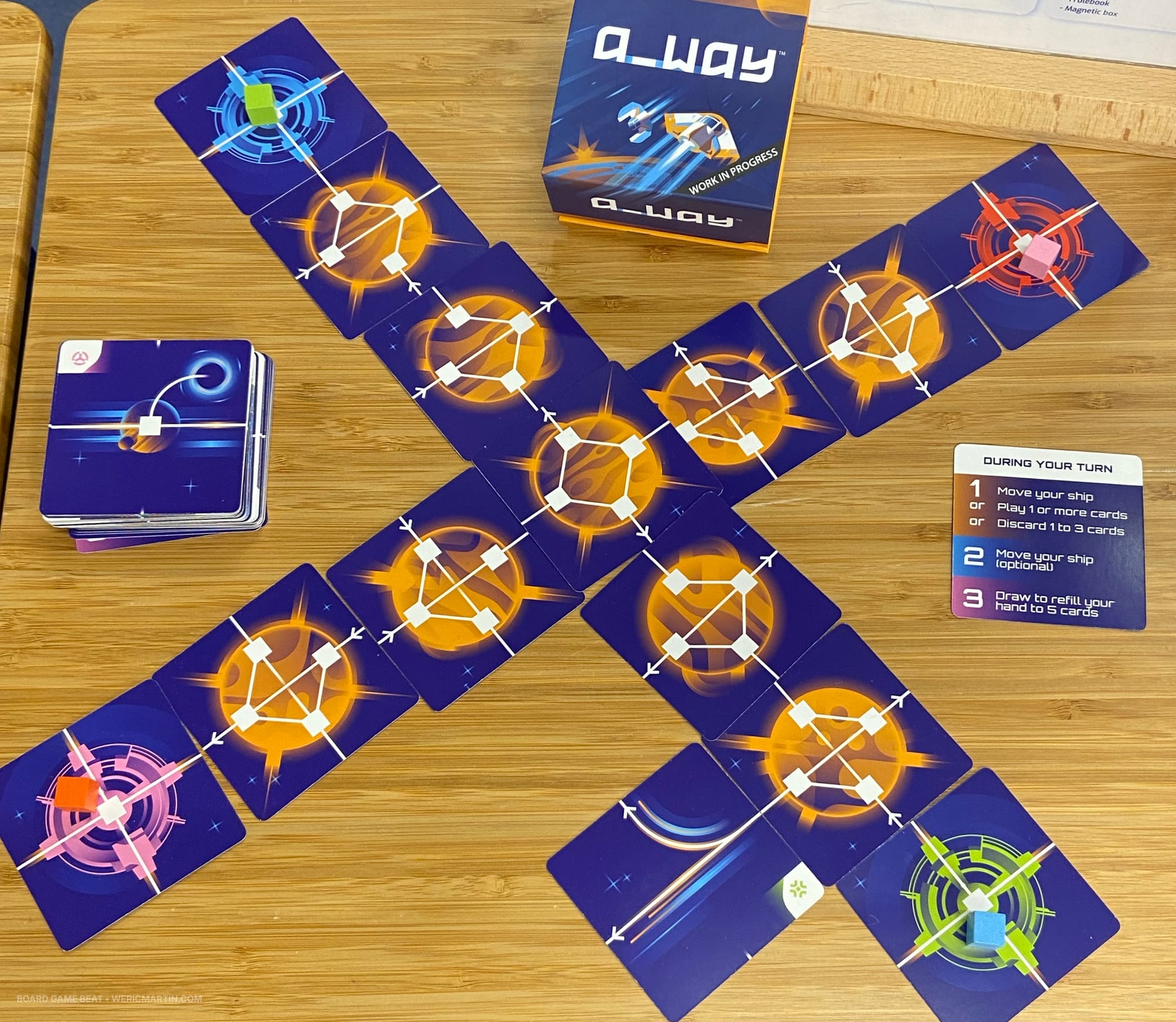 Cards are laid out in the shape of an X, with paths running across the cards in various directions