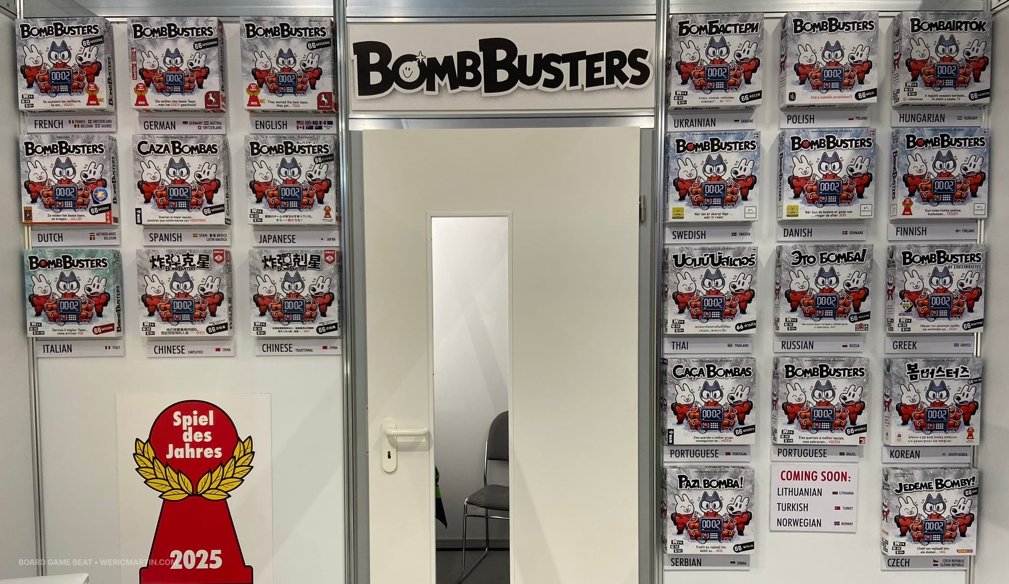 Boxes of Bomb Busters in multiple languages in the Cocktail Games booth
