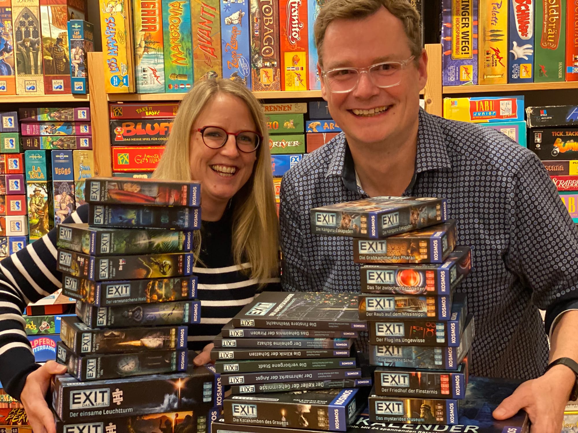 Inka and Markus Brand are pictured behind two dozen or so EXIT titles