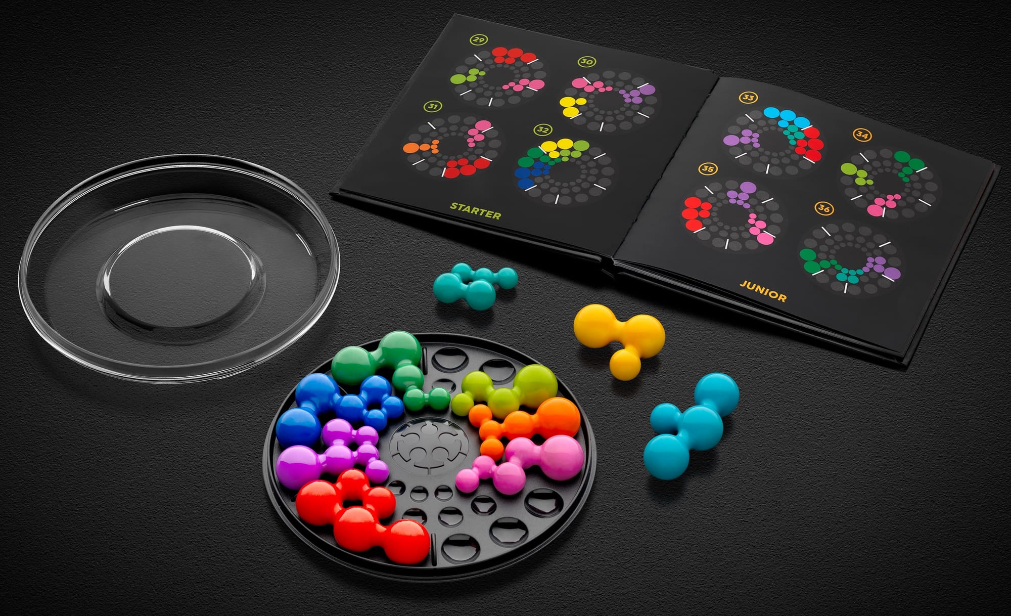 Spheres in three sizes are attached in various ways across ten plastic pieces that are meant to be arranged into a circle