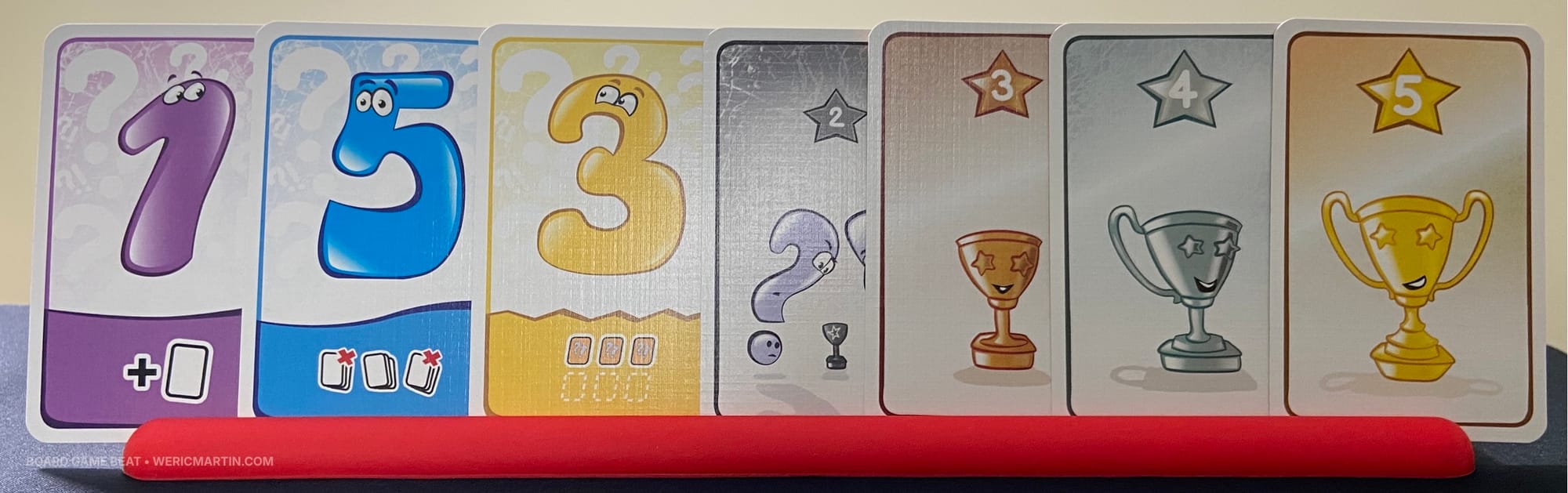 Seven cards stand in a rack