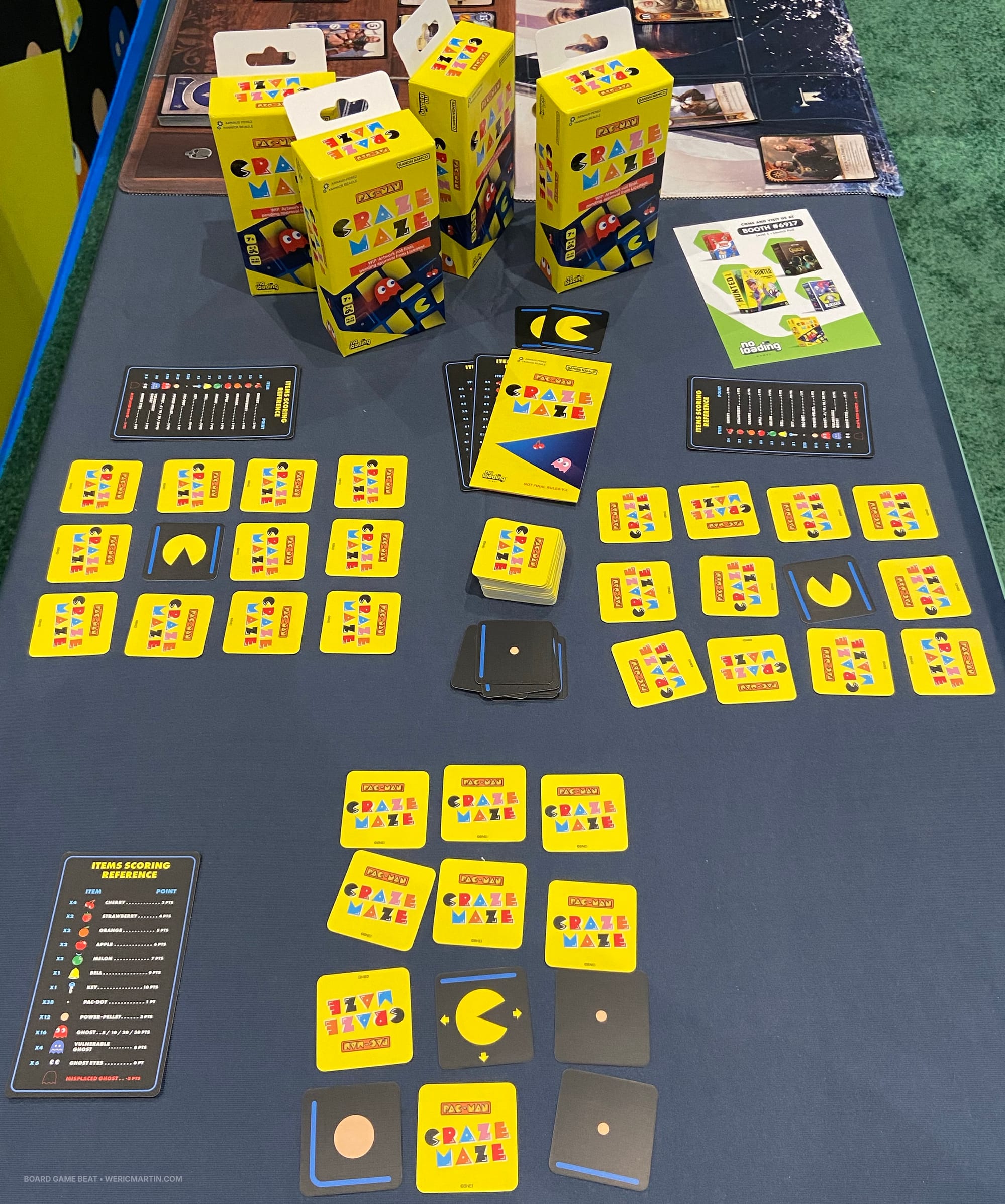 Each player has twelve cards in a 3x4 grid, with a Pac-Man card in one of the center spaces and the other cards initially face down