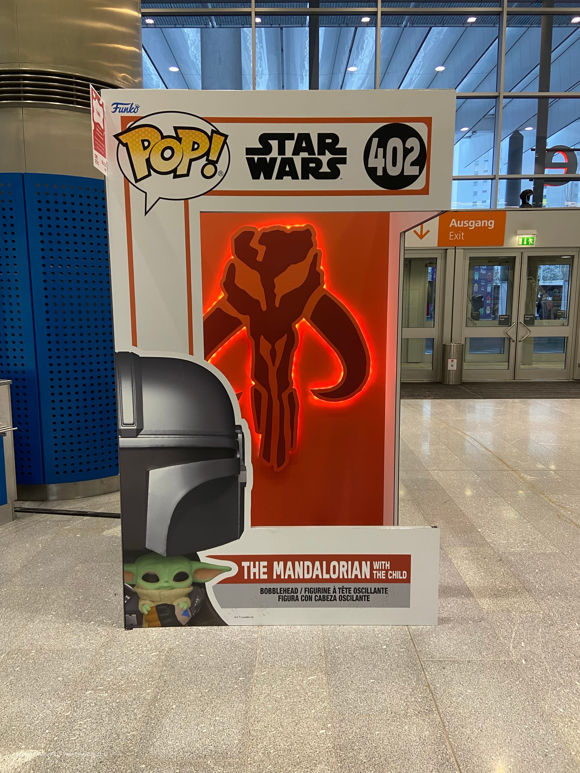 A human-sized Funko Pop! figure box bearing The Mandalorian branding