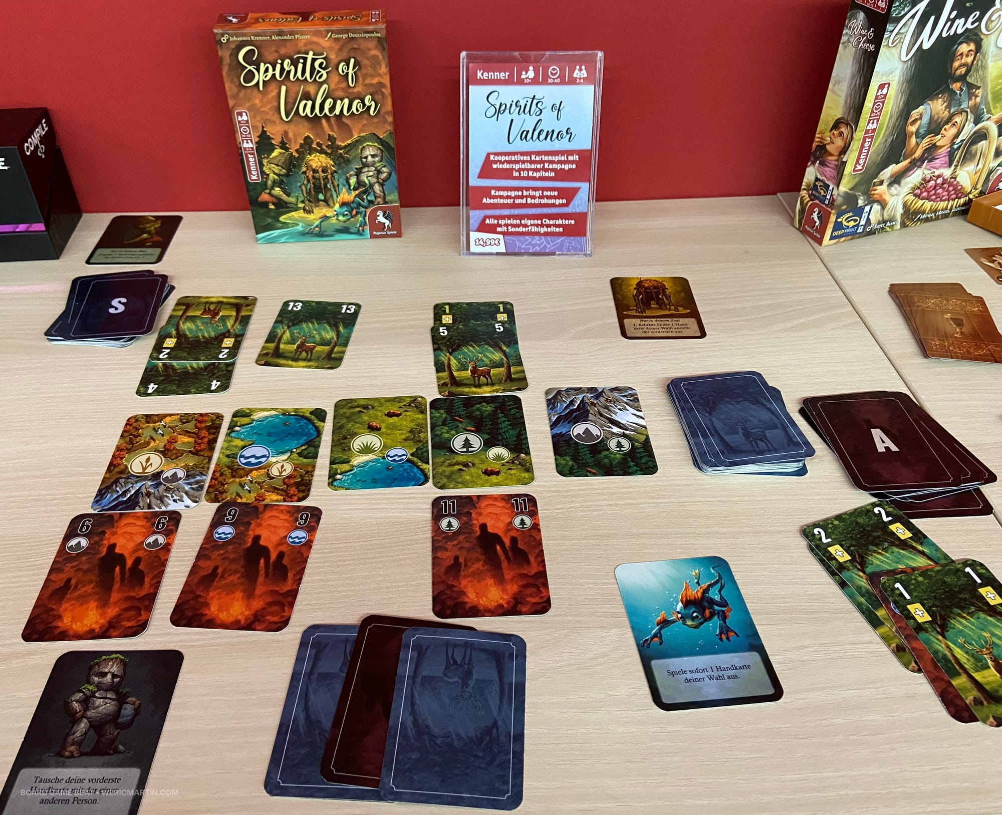 Box and components for Spirits of Valenor, with landscape and spirit cards laid out in a grid