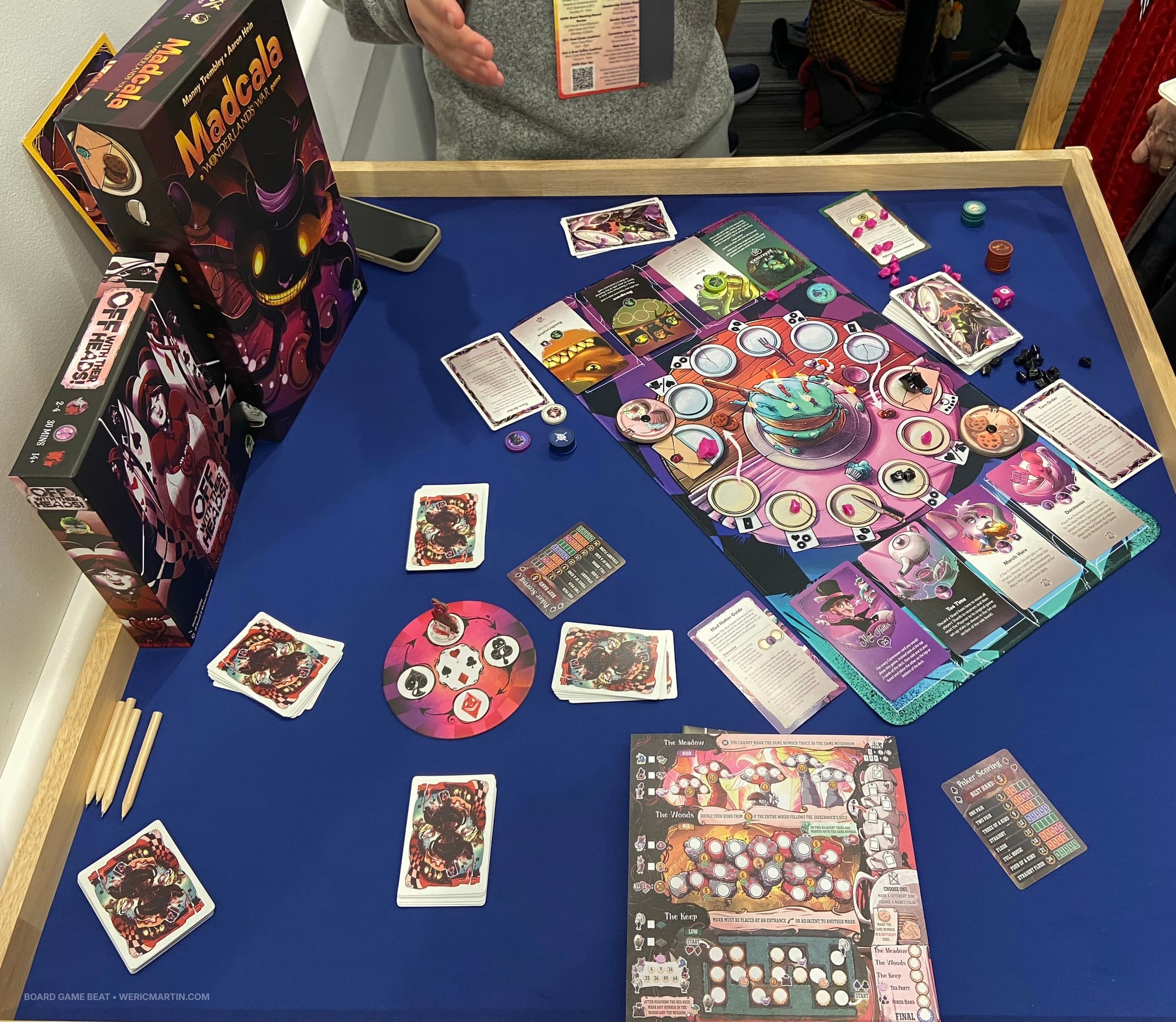 Two titles from Druid City Games are on the table: Off With Their Heads! and Madcala