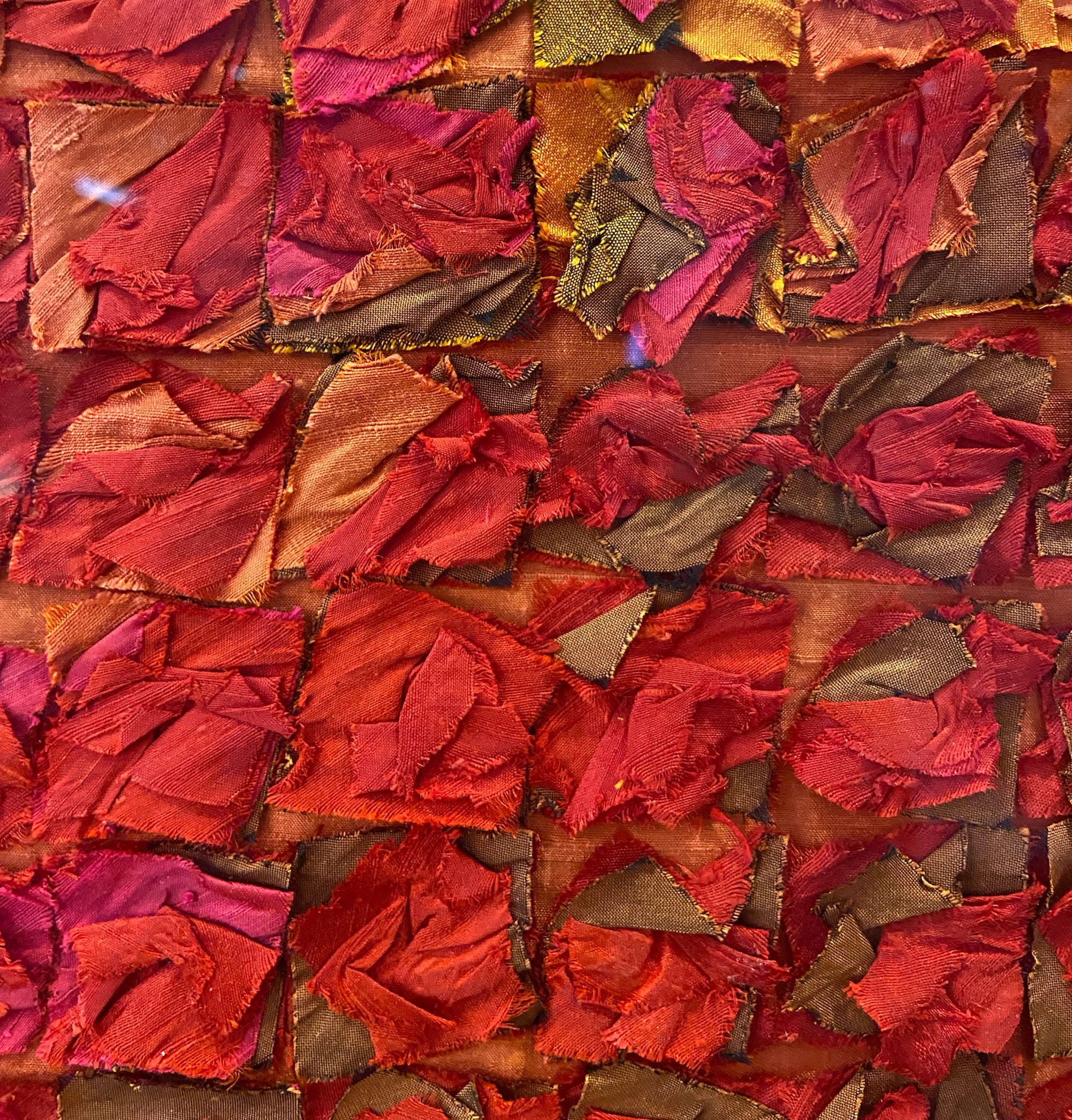 A close-up of tiny bits of silk piled on top of one another and crushed